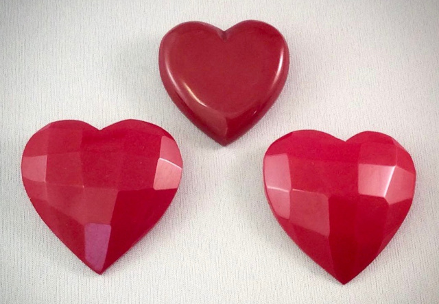 BP127  red bakelite heart pins